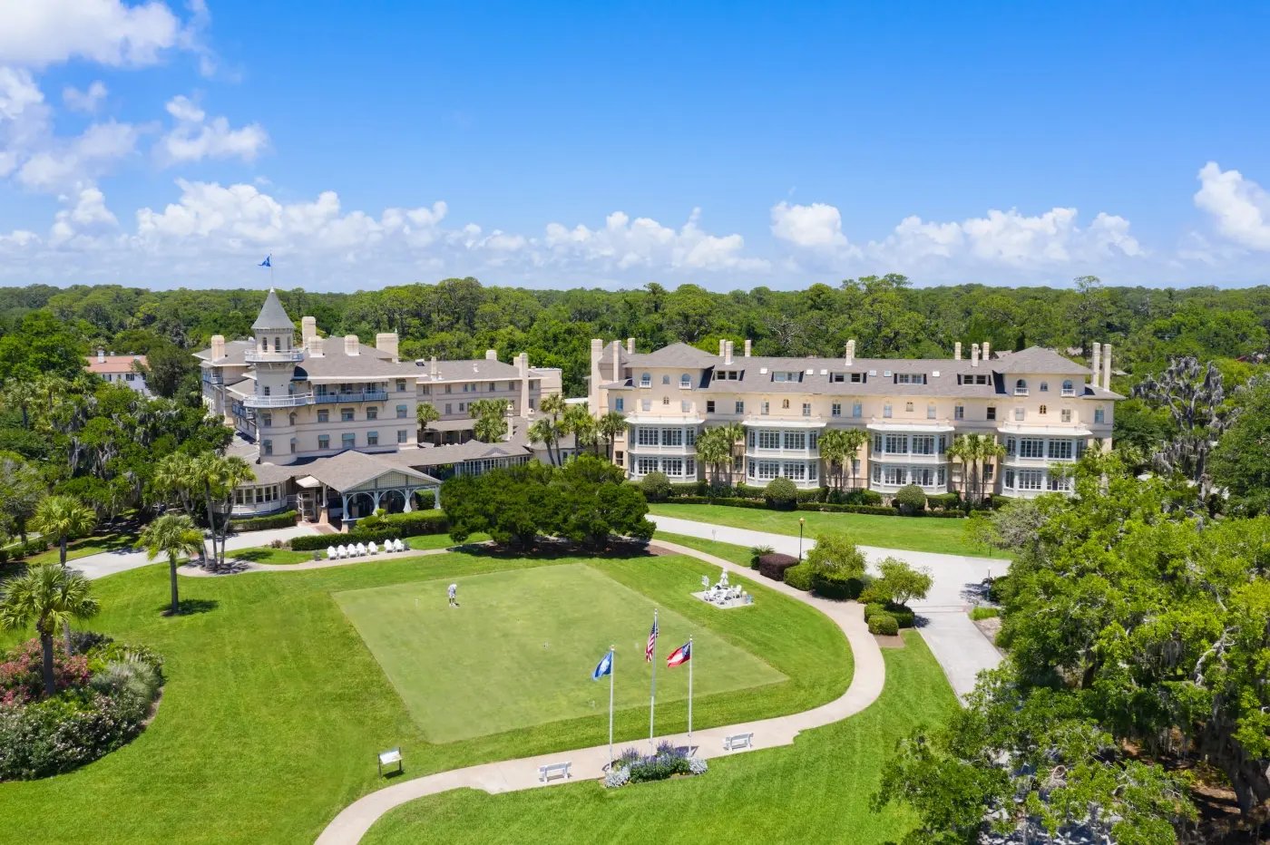 The Jekyll Island Club Resort seen from above, with its turreted clubhouse, croquet lawn, and live oaks